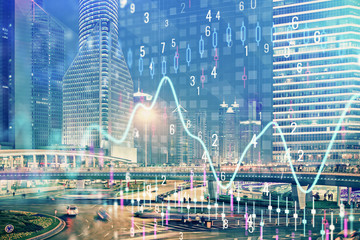 Obraz premium Financial chart on city scape with tall buildings background multi exposure. Analysis concept.