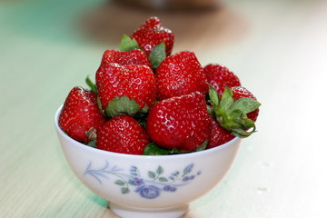 Exotic fruits. Chinese strawberries. Fresh fruits. The berries are red. China. Of Asia. Dessert.
