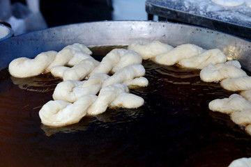 Padnoongo, Chinese style fried donut, popular street foot sold in market and space for write wording. Served with coffee or hot milk, unhealthy fried food cause heart disease, old oil cause cancer