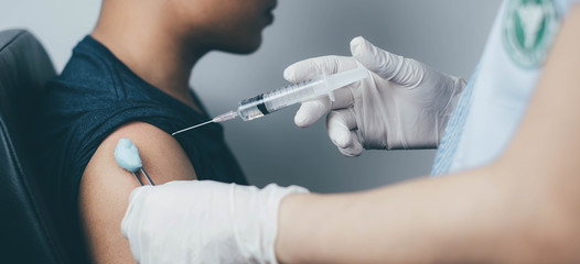 The doctor carried a syringe to treat and gave the patient a Sein measurement.Vaccination concept....