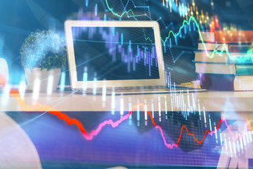 Financial chart drawing and table with computer on background. Multi exposure. Concept of international markets.