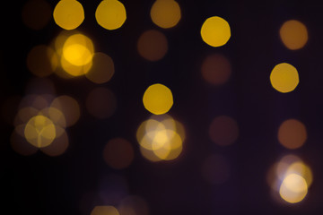 Obraz premium Christmas golden lights. Background of bright glow bokeh. - Image