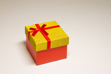 red gift box with a red bow on a light background. holiday concept, for example, Valentine's Day, women's day. the concept of love and feeling. gift. space for text. the view from the top.