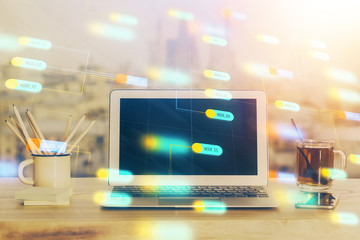 Double exposure of laptop computer and technology theme hologram. Concept of freelance work.