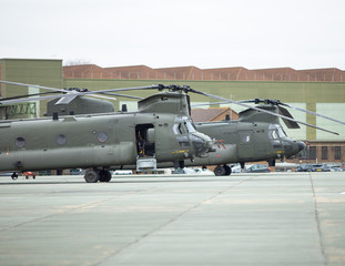 Fototapeta na wymiar Two heavy lift helicopters in army camoflague