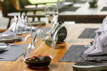 Wine decanter, wineglasses and red wine. Decanting wine ensures that the sediment stays in the bottle and you get a nice clear wine and second and more everyday reason to decant is to aerate the wine.