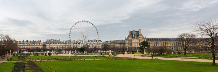 PARIS, FRANCE - Dec 16, 2019: Panorama of Tuileries Garden (Jardin des Tuileries). In the middle the "Roue de Paris" - a popular ferris wheel. The history of the garden reaches back to the year 1564.