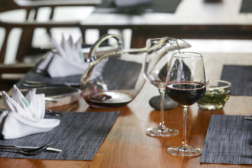 Wine decanter, wineglasses and red wine. Decanting wine ensures that the sediment stays in the bottle and you get a nice clear wine and second and more everyday reason to decant is to aerate the wine.