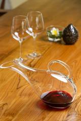 Wine decanter, wineglasses and red wine. Decanting wine ensures that the sediment stays in the...