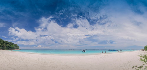 view panorama on white sand beach with blue-green sea and cloudy sky background, Tachai island, Mu Ko Similan National Park, Phang Nga, south of Thailand.