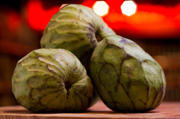 sale of exotic cherimoya fruits, still life on the market