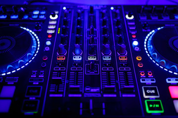 closeup view of a DJ's mixing desk