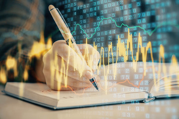 Multi exposure of woman's hands making notes with forex graph hologram. Concept of technical analysis.