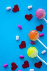 hearts and lolipops on blue background