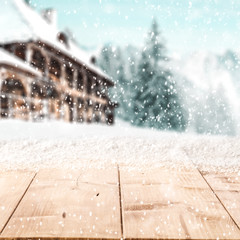 desk of free space cover of snow and winter landscape of mountains. 