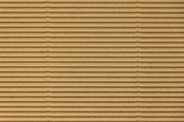 Brown corrugated Board with a horizontal texture for packaging.  Striped background made of cardboard