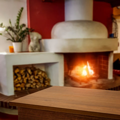 desk of free space and fireplace in home interior. 