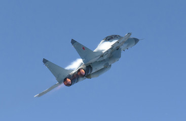 Russian Multirole Jet Fighter MiG-35 view from behind with afterburners on