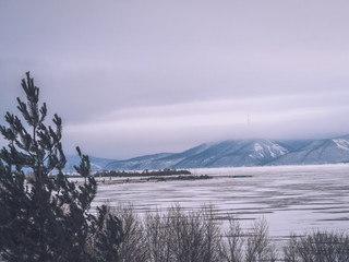 Ice landscape, endless panorama of the ice surface on the frozen river
