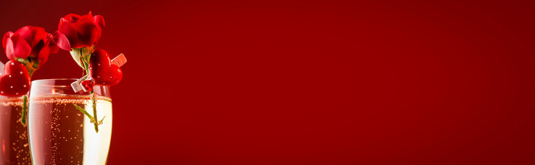 Valentines day red banner background with champagne glasses, hearts and scarlet roses, copy space