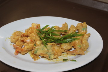 Fried shrimp with salted egg sauce and chili on top