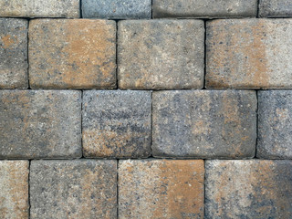 Bricks, paving stones, stacked as a wall, as a background
