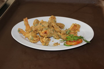 Fried shrimp with salted egg sauce and chili on top