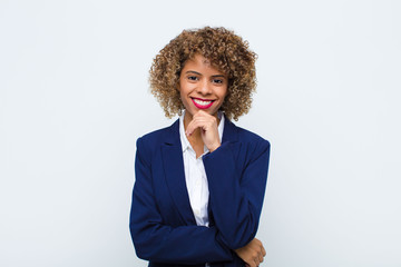 young woman african american smiling, enjoying life, feeling happy, friendly, satisfied and...