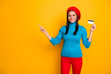 Fototapeta na wymiar Portrait of her she nice attractive cheerful cheery girl showing atm card online shopping buying purchase order new novelty copy space isolated on bright vivid shine vibrant yellow color background