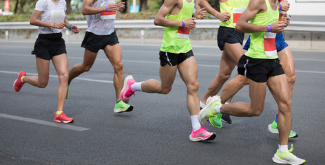 Marathon runners running on the race on city road