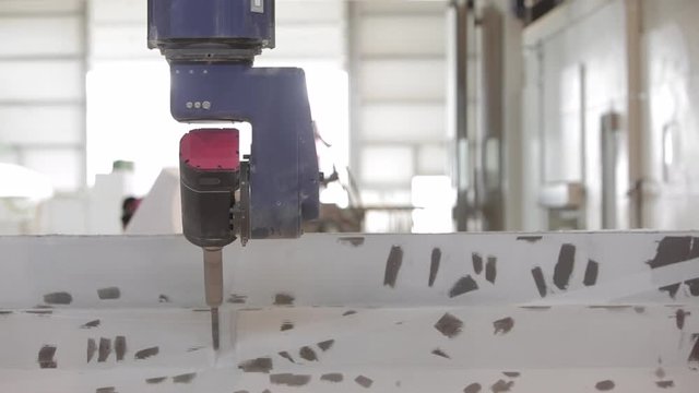 Industry Robot carwer machine - back view 2- carwing out fiber glass - boat factory