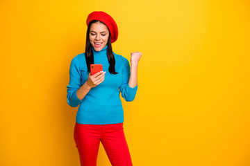 Portrait of her she nice attractive lovely glad satisfied cheerful cheery girl holding in hands using cell fast shipping order buying isolated over bright vivid shine vibrant yellow color background
