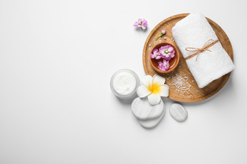 Composition with spa stones on white background, top view