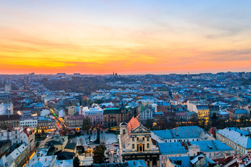 Fototapeta na wymiar Aerial view of the old town of Lviv in Ukraine at sunset. Lvov cityscape. View from tower of Lviv town hall