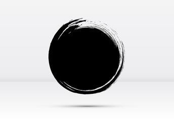 Abstract brushed black ink circle with rough edges and grungy texture