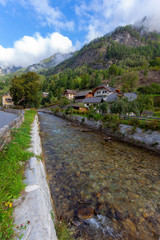 Fototapeta na wymiar The village on the upper course of the Mur (Mura) River in Austrian Alps