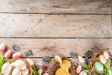 Spring Easter holiday. background. Zero waste Easter concept with traditional Easter decoration - eggs, flowers, branches, bunny. Eco friendly lifestyle, Above copy space