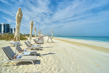 Empty sunbeds at Saadiyat beach in Abu Dhabi