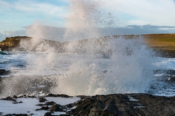 Spray from a large wave hitting the Cornish coast in January