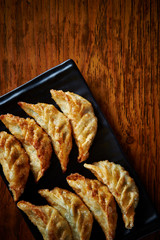 Deep fried dumpling on black plate 