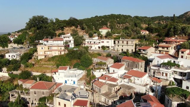 Drone Descending Fast Towards MOUNTAIN VILLAGE CHURCH CRETE GREECE