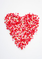 Shape of heart, sugar confetti, greeting card design, sweet food. Valentines day. Romantic, symbol of love.