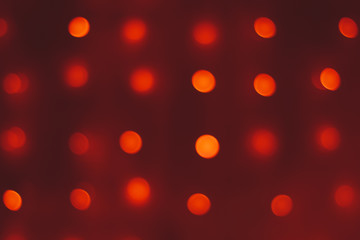 Round bokeh on a dark red background