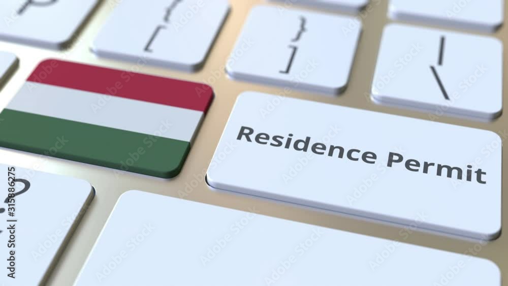 Poster residence permit text and flag of hungary on the buttons on the computer keyboard. immigration relat