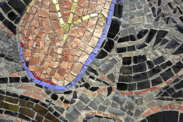 Mosaic pattern of multicolored tiles on the wall