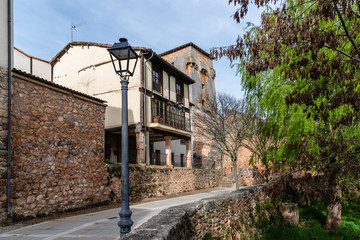 Picturesque view of the promenade along the river Arlanza in the village of Covarrubias