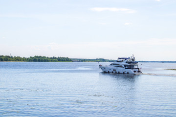 The Golden ring of Russia. Sunny summer day in Yaroslavl. Bank of the Kotorosl river. Boats on the river