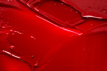 Smear and texture of red lipstick or acrylic paint. - Image