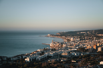 Scenic view over beach town against clear sky