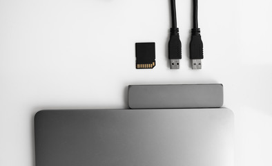 Laptop with USB Type-C adapter with pluged USB cables and SD card. The USB adapter under the Type-C...